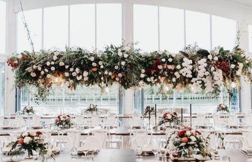 Waterfront wedding venue hanging flowers