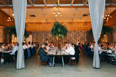 wedding guests eating in reception hall