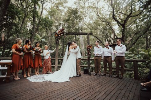 A couple are married on the wedding deck.