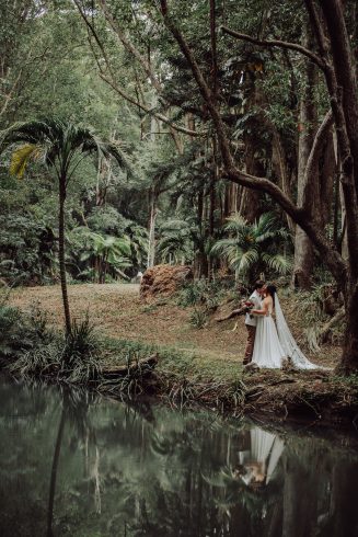 A couple kiss at the river, a beautiful photo location surrounded by nature
