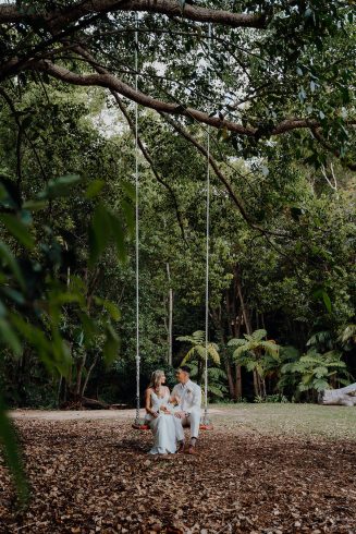 Bride + groom on acre wooden swing