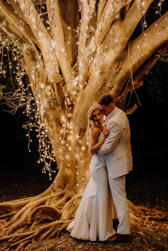 Bride + groom fairy lights in tree