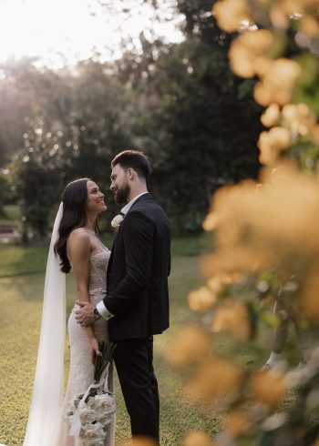 Bride + groom in garden