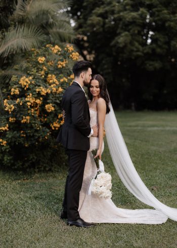 Bride + groom with yellow flowering tree